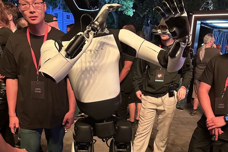 Tesla Optimus Robot Walks, Interacts at We, Robot Event