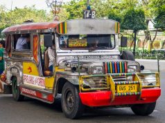 Jeepney Crash Kills 4, Injures 10 in Philippines A colorful jeepney with chrome details and hand-painted scenes on a rural road in Oriental Mindoro, Philippines.