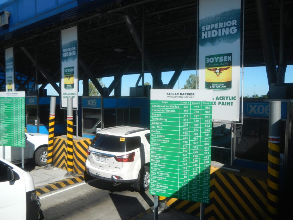 Emergency responders at a damaged tollbooth in Colombia after a truck crashed and set vehicles on fire.