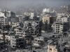 Gaza War Kills 75,811 People gathered near a damaged building in Gaza, surveying the aftermath of an airstrike