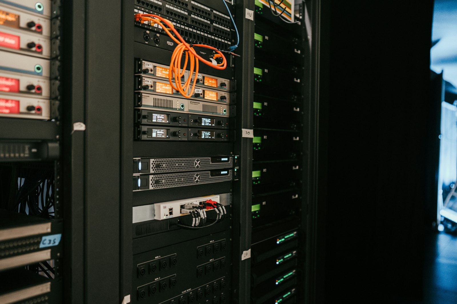a rack of servers in a server room